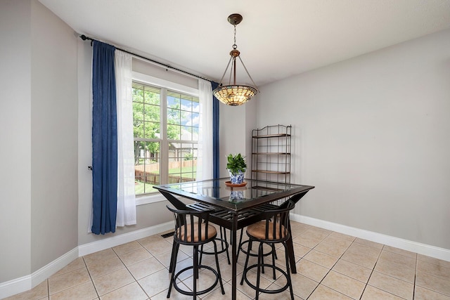 2310 Lakeside Ct, Ozark, MO 65721 - dining space with light tile patterned floors, baseboards, and a chandelier
