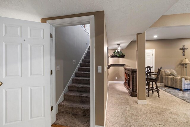 2310 Lakeside Ct, Ozark, MO 65721 - stairs with carpet floors, baseboards, recessed lighting, and a textured ceiling