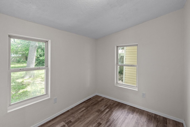 1433 E 24th St N, Springfield, MO 65803 - unfurnished room featuring plenty of natural light, wood finished floors, vaulted ceiling, and baseboards