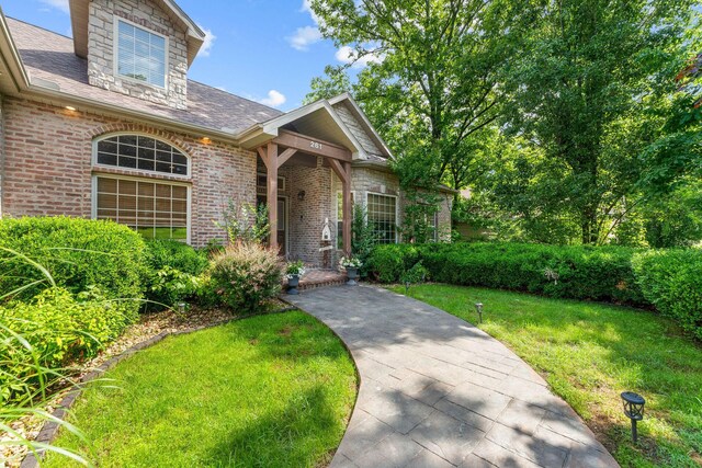 261 Country Bluff Dr, Branson, MO 65616 - view of front of home featuring brick siding and a front lawn