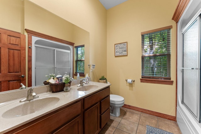 261 Country Bluff Dr, Branson, MO 65616 - bathroom with a shower with door, double vanity, toilet, baseboards, and tile patterned floors