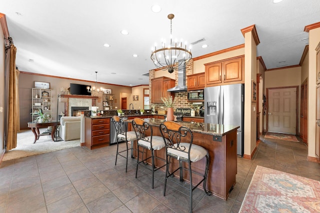 261 Country Bluff Dr, Branson, MO 65616 - kitchen with appliances with stainless steel finishes, a chandelier, a peninsula, recessed lighting, and crown molding