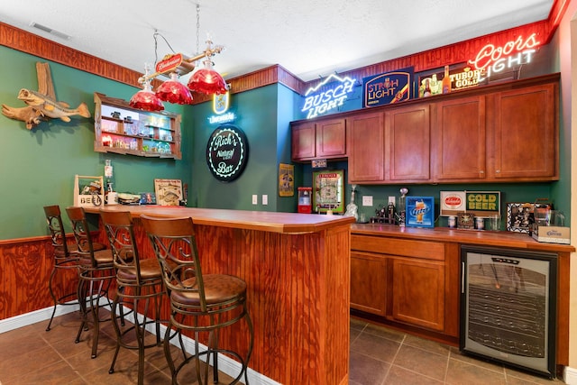 261 Country Bluff Dr, Branson, MO 65616 - indoor dry bar with beverage cooler and a textured ceiling