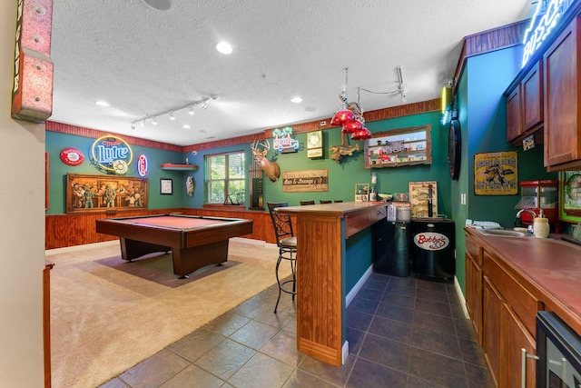 261 Country Bluff Dr, Branson, MO 65616 - playroom featuring track lighting, dark carpet, a dry bar, a textured ceiling, and billiards table