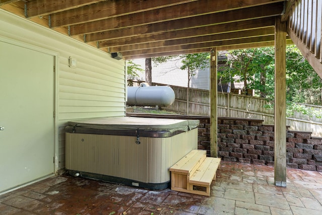 261 Country Bluff Dr, Branson, MO 65616 - fenced backyard featuring a hot tub and a patio area
