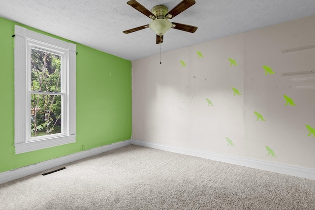 537 S Jefferson Ave, Aurora, MO 65605 - unfurnished room featuring carpet, baseboards, a textured ceiling, and ceiling fan