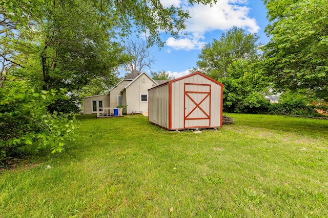 537 S Jefferson Ave, Aurora, MO 65605 - view of green lawn with a shed and an outbuilding