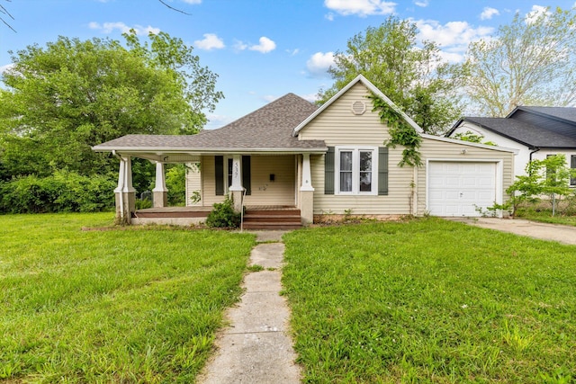 537 S Jefferson Ave, Aurora, MO 65605 - view of front facade featuring covered porch, an attached garage, concrete driveway, a front lawn, and a shingled roof