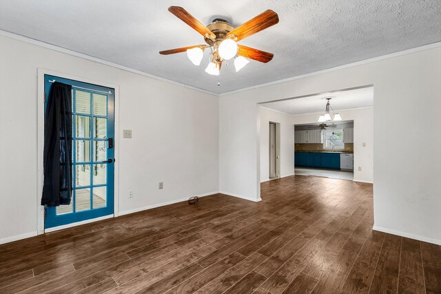 537 S Jefferson Ave, Aurora, MO 65605 - empty room with dark wood-type flooring, ceiling fan, baseboards, ornamental molding, and a chandelier