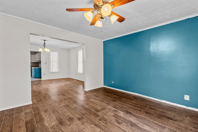 537 S Jefferson Ave, Aurora, MO 65605 - unfurnished room featuring a textured ceiling, wood finished floors, ornamental molding, and baseboards