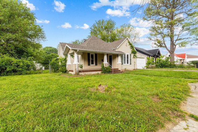 537 S Jefferson Ave, Aurora, MO 65605 - single story home featuring covered porch, a garage, a front lawn, and a shingled roof