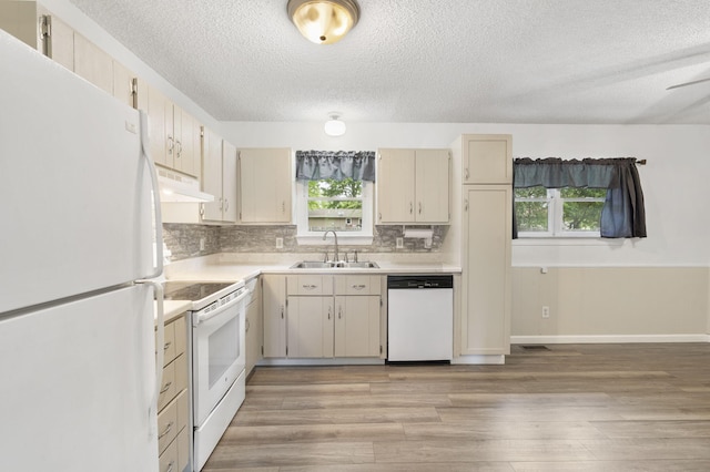 127 Wilson Way, Marshfield, MO 65706 - kitchen with white appliances, a sink, light countertops, a textured ceiling, and under cabinet range hood