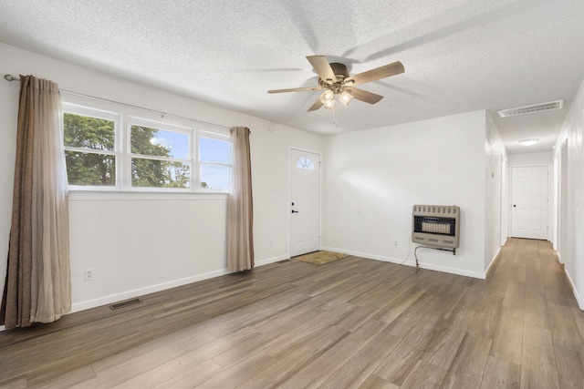 127 Wilson Way, Marshfield, MO 65706 - foyer with heating unit, ceiling fan, wood finished floors, a textured ceiling, and baseboards