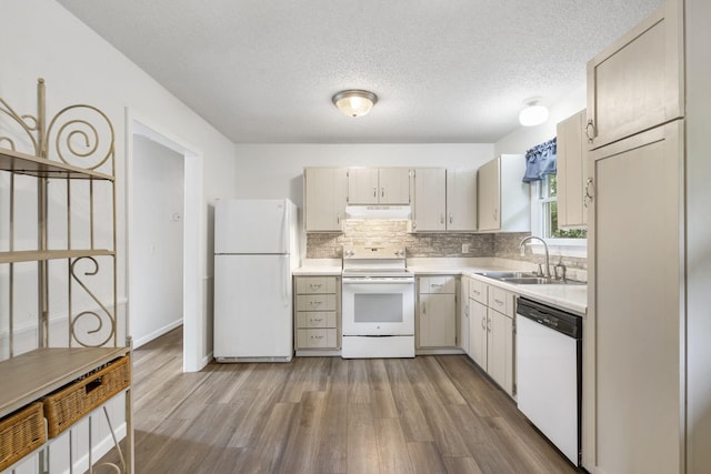 127 Wilson Way, Marshfield, MO 65706 - kitchen featuring white appliances, a sink, light countertops, wood finished floors, and a textured ceiling