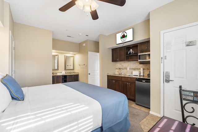 2800 Green Mountain Dr Unit 231, Branson, MO 65616 - bedroom with ensuite bathroom, a sink, light tile patterned floors, a ceiling fan, and refrigerator