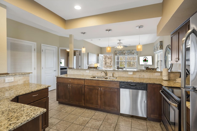 2800 Green Mountain Dr Unit 231, Branson, MO 65616 - kitchen with stainless steel appliances, a sink, light tile patterned floors, backsplash, and dark brown cabinets