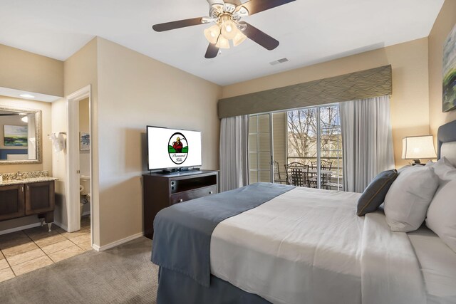 2800 Green Mountain Dr Unit 231, Branson, MO 65616 - bedroom with baseboards, a ceiling fan, light carpet, ensuite bath, and access to exterior