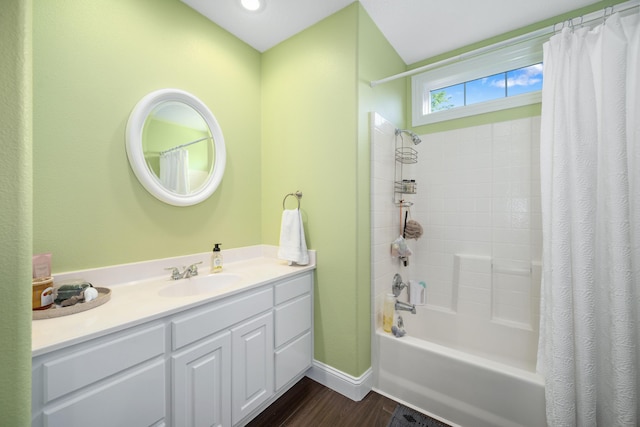 2820 Waters Edge Blvd, Joplin, MO 64801 - full bathroom with wood finished floors, shower / bath combo with shower curtain, baseboards, and vanity