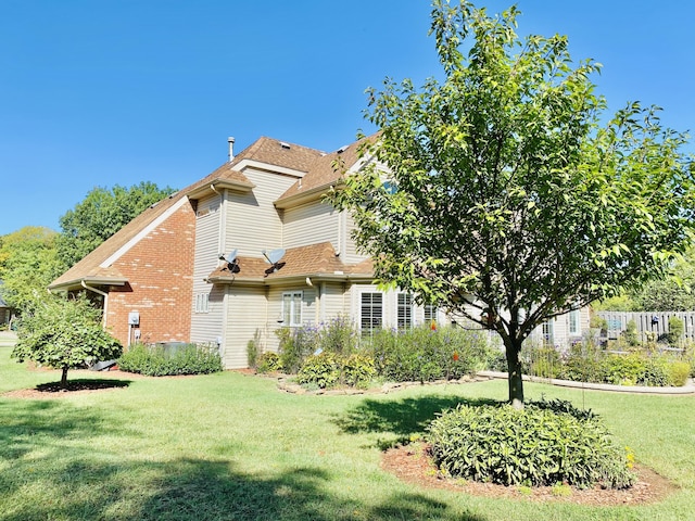 2820 Waters Edge Blvd, Joplin, MO 64801 - view of home's exterior featuring a yard and a shingled roof