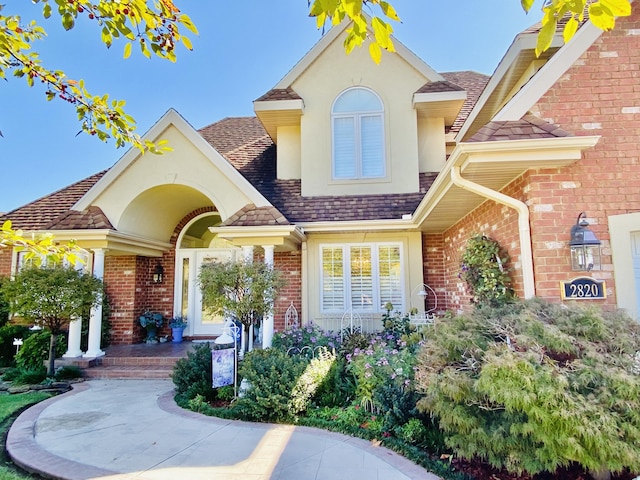 2820 Waters Edge Blvd, Joplin, MO 64801 - view of front facade featuring brick siding, stucco siding, and a shingled roof