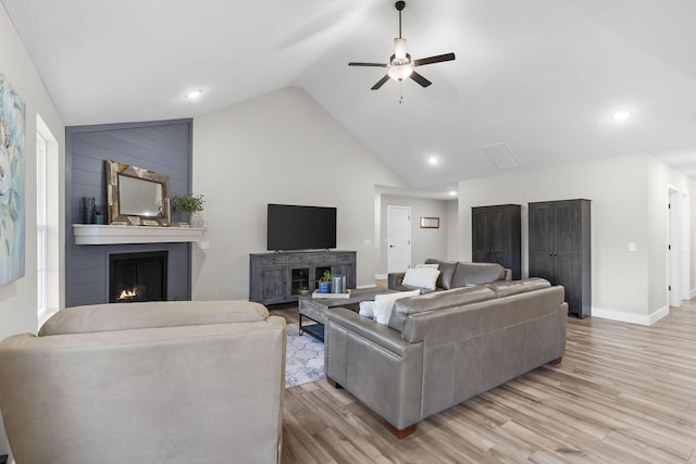 427 N Maynard Rd, Nixa, MO 65714 - living room with a fireplace, ceiling fan, lofted ceiling, light wood-style flooring, and baseboards