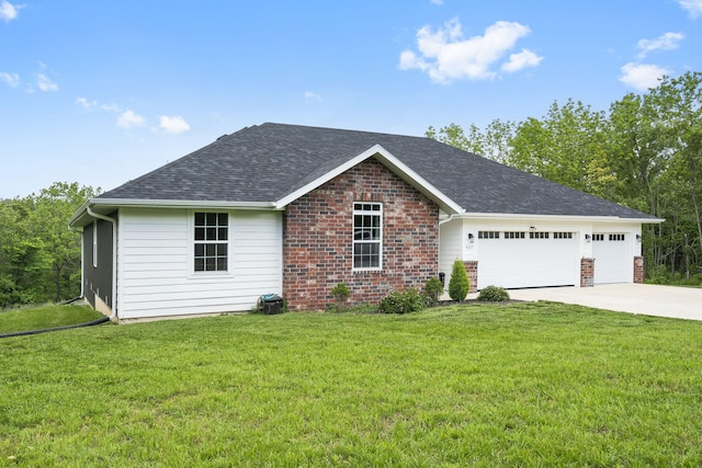 427 N Maynard Rd, Nixa, MO 65714 - ranch-style house featuring a garage, concrete driveway, a front yard, and brick siding