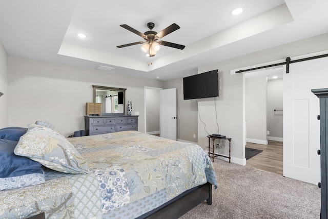 427 N Maynard Rd, Nixa, MO 65714 - bedroom featuring a barn door, a raised ceiling, carpet floors, baseboards, and recessed lighting
