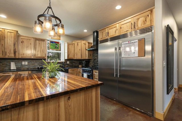 217 Victory Ln, Niangua, MO 65713 - kitchen featuring butcher block countertops, high quality appliances, wall chimney exhaust hood, tasteful backsplash, and concrete floors
