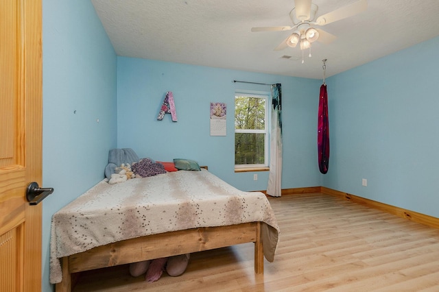 217 Victory Ln, Niangua, MO 65713 - bedroom featuring light wood-type flooring, baseboards, and a ceiling fan