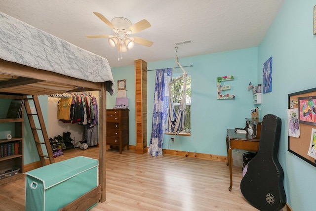 217 Victory Ln, Niangua, MO 65713 - bedroom featuring wood finished floors, a desk, baseboards, and ceiling fan