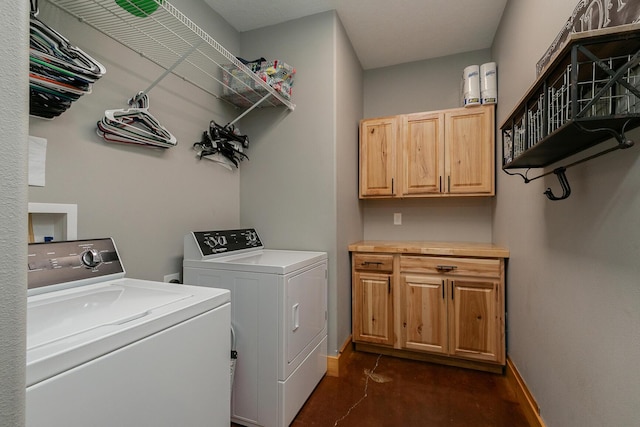 217 Victory Ln, Niangua, MO 65713 - clothes washing area featuring washer and dryer, cabinet space, and baseboards