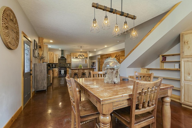217 Victory Ln, Niangua, MO 65713 - dining space featuring baseboards, concrete floors, recessed lighting, and a textured ceiling