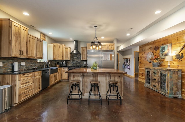 217 Victory Ln, Niangua, MO 65713 - kitchen with built in refrigerator, wall chimney exhaust hood, black dishwasher, finished concrete floors, and a kitchen bar