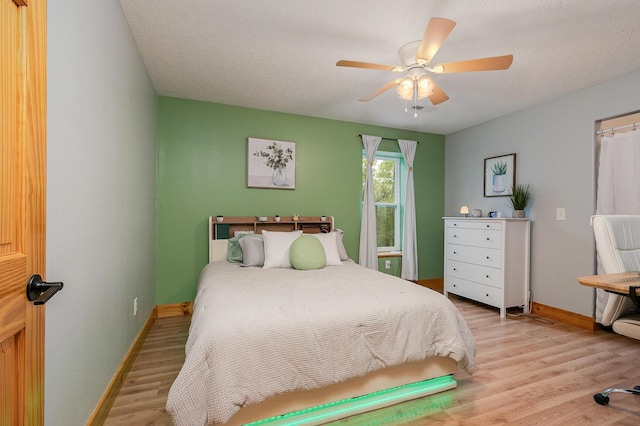 217 Victory Ln, Niangua, MO 65713 - bedroom featuring baseboards, light wood-type flooring, and a ceiling fan