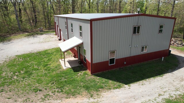 217 Victory Ln, Niangua, MO 65713 - view of property exterior with dirt driveway, a yard, and a forest view