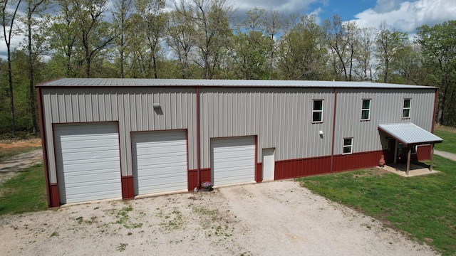 217 Victory Ln, Niangua, MO 65713 - detached garage featuring view of scattered trees