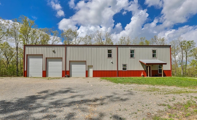217 Victory Ln, Niangua, MO 65713 - view of front facade with an outdoor structure, board and batten siding, and a garage