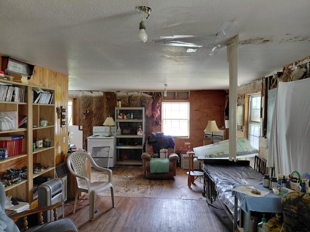 605 N Marr St, Mountain View, MO 65548 - misc room with a textured ceiling, hardwood / wood-style flooring, and wood walls