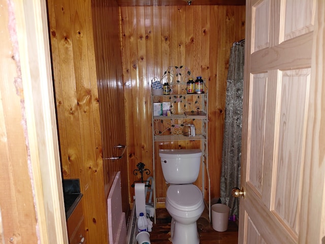 605 N Marr St, Mountain View, MO 65548 - bathroom featuring toilet, wooden walls, and wood finished floors