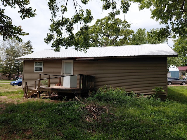 605 N Marr St, Mountain View, MO 65548 - rear view of house with a deck and metal roof