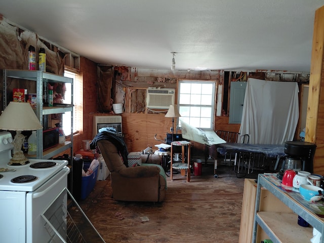 605 N Marr St, Mountain View, MO 65548 - living area featuring an AC wall unit and wood finished floors