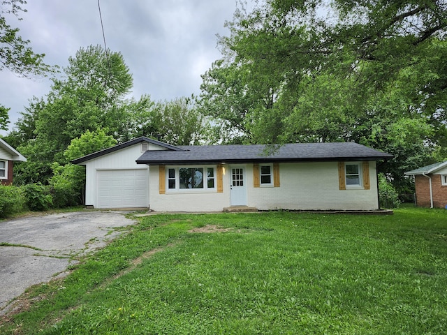 313 N Mill St, Marshfield, MO 65706 - single story home with asphalt driveway, brick siding, a garage, and a front yard