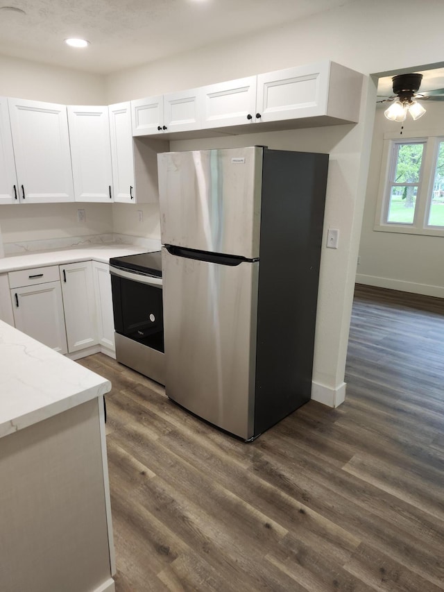 313 N Mill St, Marshfield, MO 65706 - kitchen with stainless steel appliances, white cabinetry, light stone counters, and recessed lighting