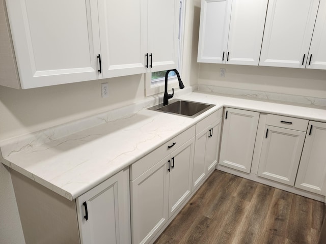 313 N Mill St, Marshfield, MO 65706 - kitchen featuring a sink, dark wood-style floors, white cabinets, and light stone counters