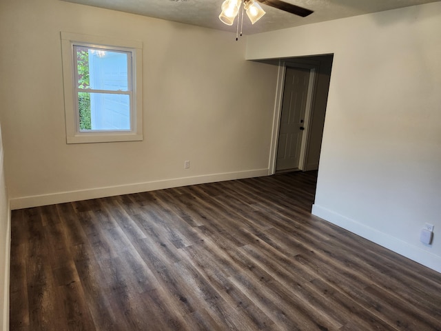 313 N Mill St, Marshfield, MO 65706 - empty room featuring ceiling fan, baseboards, and dark wood finished floors