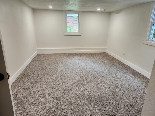 313 N Mill St, Marshfield, MO 65706 - carpeted spare room featuring baseboards and recessed lighting