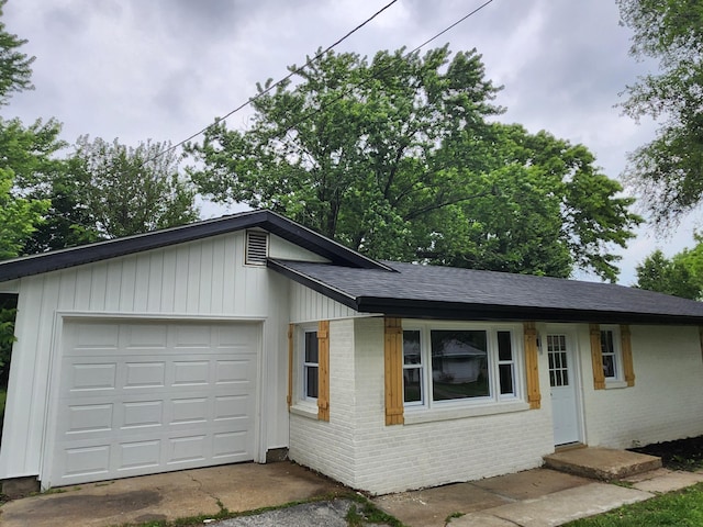 313 N Mill St, Marshfield, MO 65706 - single story home featuring brick siding, a shingled roof, and a garage
