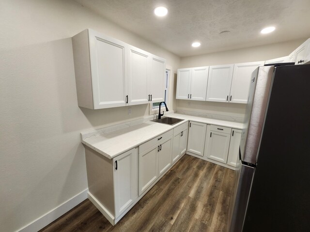 313 N Mill St, Marshfield, MO 65706 - kitchen with freestanding refrigerator, a sink, dark wood-style floors, recessed lighting, and baseboards