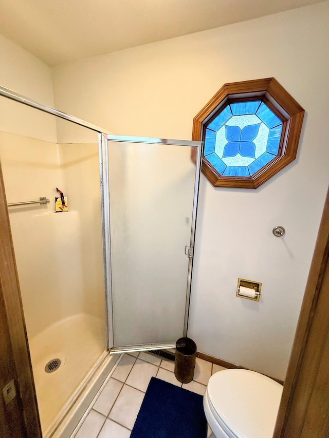 912 Domino Ct, Nixa, MO 65714 - full bath with tile patterned flooring, a shower stall, and toilet