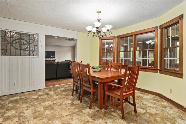 8495 Hwy N, Mountain Grove, MO 65711 - dining area featuring a chandelier, baseboards, and a textured ceiling